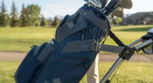 Detailed view of strap pass-through features on a golf bag for secure push cart attachment.