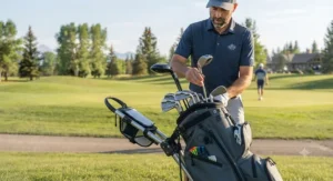 A golfer organizing clubs in a golf bag specifically designed for easy access while using a push cart.