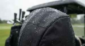 Close-up of durable, waterproof fabric on a golf bag rain cover for cart bags protecting against sudden rain showers.