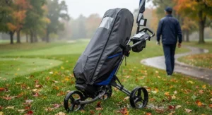 Waterproof golf bag rain cover secured securely over a golf bag on a push cart during an autumn shower
